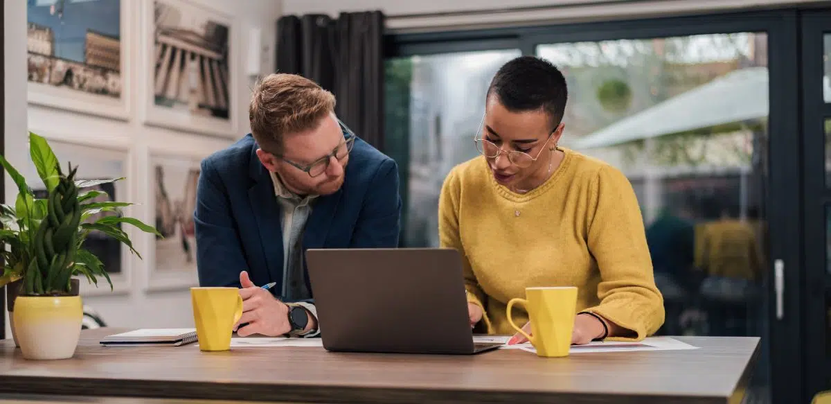 Hardworking business partners, working from home, helping each other.